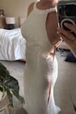 I love this dress. I got it for a bridal shower. The fit is strange just because it doesn't clasp in the back. Unless you are really tiny with larger breasts, it'll probably have some gaps. See picture tried my best to show the gap. I will probably just safety pin the dress to fit better. - Chloe B.
