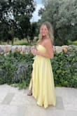 Ordered this for an Italian wedding. It's so soft and comfortable, you don't feel squeezed in. The corset on the back lets you tighten as much as needed. Wasn't worried about pulling it up all night. The color is a deep pale yellow, got lots of compliments. The slit is perfect for dancing! - Maddie W.