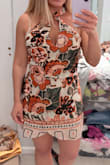This dress has a very strange top; the straps that should cross and then tie around back of your neck do not sit flat in the front, making the fabric bulge out and look sloppy. It's impossible to even tie the straps tighter, as you then are literally choking yourself. Will be sending this one back. - Brittany F.
