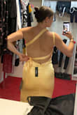 The dress is amazing! I love the fabric and style, it feels very nice. I was afraid it would show a lot since it is light color but not actually, I do not feel big or anything. But I do have one small issue. Once you try to tighten the straps, the lower one kind of falls and it does not make the nice look on your back as on pictures. I will have to sew a loop on side of my hip so the bow stay on one place and the straps look nicer. - Eliska G.