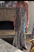 I wanted to be sure to post this since thus far, there aren't any review photos of the sage color.  

I love this dress and think it is stunning!  I ordered it because it was so beautiful and flattering on pretty much everyone.  

Quality is decent but not the greatest for the price.  The zipper sticks a bit halfway up and it feels like I need to be very careful or the zipper or fabric might tear.  I am a little concerned how well it will hold up over several hours of wear, sitting, dancing, etc.  

I agree with what others have said about the fit.  There is ZERO stretch or forgiveness in the waist.  It fits but if you enjoy things like breathing, eating, sitting or bending over, this dress will test you.  

I haven't decided whether or not to keep it due to these concerns.  It's gorgeous but I also don't want to be uncomfortable all night. - Mattea B.