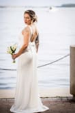 I don't usually write reviews, but this dress deserves it. I fell in love the moment I saw it online. I ordered a Medium and a Large - went with the Large. If you're between sizes, size up since there's not much stretch. It looked beautiful and made me feel amazing on my wedding day. Highly recommend. - Juliana V.