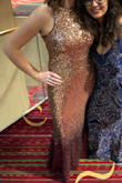 I wore this dress to a black-tie awards gala, and got so many compliments. It's perfect if you're prepared to stand out in a crowd. And you can wear a strapless bra! Just have your spanks ready to go, too.
I'm 5'6, and had to have a size medium slightly shortened with 3-4 inch heels, but otherwise, it fit like a glove. It hugs your figure in a very flattering way. - Michelle Z.