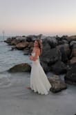 This dress was so so gorgeous and perfect for my graduation photos!!! It was very good quality and well-made. Around my chest it was perfect as I could tie it to be tighter, but around my waist the back had a slight gap. I wouldn't size down though, just slightly loose but nothing a pin couldn't fix for my photos. - Addison H.