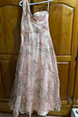 After looking at this dress for months and finally deciding to order it for my wedding anniversary, I was so excited to get it only to be disappointed that it looks clumsy. Despite getting into the dress, it could not be zipped with no adjustment possible. Should have listened to the signs when the order encountered problems to be purchased. 
What a waste of precious money! - Shyda S.