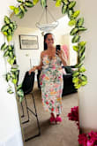 Bought this during a sale because I love floral prints, wore it today out to a patio lunch with a friend. Looks great, true to size, besides being a little snug in the bust. I wear a LuLus XL in skirts and dresses and am a 12/14 pants, & L in shirts everywhere else. I wore a strapless 36DD, and I did have to adjust several times. There is room for hips and butt, which is great for us curvy girls. The straps fit the dress; they don't take away from the style at all. It's a very spring/light summer dress, and the ties are appropriate. I do wish it had a front thigh slit, and I may get it altered to add one in. If you're on the fence, buy it. Perfect for a summer wedding or party. - Stephanie P.