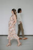 Wore this dress when 22 weeks pregnant for some maternity photos - I'm normally an XS or S (depending) and ordered a M. It fit perfectly and was so comfortable!! Would definitely recommend. - Katharine R.