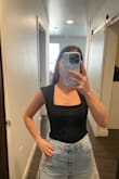 Fits great! I have small boobs and I don't look flat chested at all, it's low enough that it looks great on me. - Jessica J.
