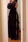 This dress is exactly like the photos! It fits perfectly and the color is so beautiful! I really like how it is tighter at the top and waist and  then opens into the beautiful layer skirt! The fabric is also great! I believe this dress is great to many occasions! I intend to wear it as a wedding guest, but I can see myself using it in the future in many other types of events! Just buy it! You won't regret it! - Carolina R.
