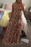 This dress is soooo beautiful, will be wearing it for an Italian wedding! If you are in between sizes, you could size down. I'm usually between a small and a medium, and the small fit perfectly if not a tad big. Love it! - Sydney M.