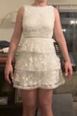 I bought this dress for my bridal dinner party but the style wasn't what I hoped for. To me, the dress looks very Easter-y or even like a flower girl dress for adults. It felt scratchy on the inside in the few minutes I tried it on. It fit me fine (S). I did return the item. - Haley W.