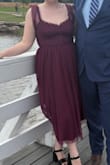 Perfect dress for a wedding. I wore the sleeves up on my shoulders and it didn't require constant adjustments which I really enjoyed! Ran a little small. I am sometimes a large sometimes an XL and I got an XL. It was tight in the waist, but fine everywhere else. - Nocona E.