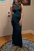 This was the perfect prom dress, and would still work well for so many formal occasions. It was so flattering and fit very well. Got lots of compliments. I love the emerald green color. The bow on the back and the ruffles were a great touch. My only suggestion would be to add padding since it is backless, but other than that, I couldn't be happier with this good of a dress for such a good price! - Caroline S.