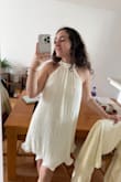 I bought this dress as a second look for my civil wedding, and I've gotten so many compliments. The fabric is very nice, the color too, the halter neck super flattering. - Ariella B.
