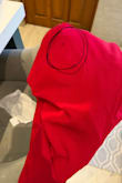 I just received my order of two dresses and one of them arrived stained. I would like to return both dresses and get a refund. - Cristina A.
