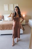 This dress is absolutely perfect. So flattering and fits nicely and makes my olive skin look warm and glowy. I originally ordered my usual size S and ended up exchanging it for the XS because it was big in my hips and chest. I'm a 32C, 5'3, 120 pounds. - Courtney K.