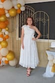 The dress is beautiful and loved the material. Only thing is that it does run small. I had to make some adjustments to the dress, but overall, it was the life of the party, everyone loved it!! - Emely M.