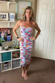 This dress is exactly what I was looking for. The fit it true to size. It's stretchy and comfortable. The straps are adjustable, which is a bonus. - Becky H.
