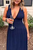 I loved this dress and got soooo many compliments! I felt like the back was a little tight, but I also have a bigger chest so that is probably why. The straps also would slide a little, but nothing horrible! It was so flattering and comfy. Such good material, and I felt like a goddess! - Hannah H.