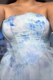 This dress is so pretty! I love the pattern and the way it flares out at the hips; however, the top boning of the corset dress has no sort of thicker material. It is quite literally 2 pieces of fabric with plastic rods in them, and when worn, the plastic bends and makes the dress look really cheap. If it lies flat, it is stunning. I was hoping to find a dress for my graduation, but with the top being wonky and the poof would probably be too much under my gown, I'll keep looking. - Jisela R.