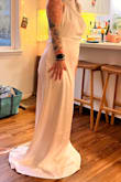If I could have chosen just the back of this dress, I would have. It was AMAZING! But the front made me feel like there was a plastic bag on my chest. The look was not flattering. I hadn't steamed it yet, but based on other reviews, the way it's pictured here is just how it is. - Elora S.