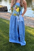 Daughter wore this to prom and it was beautiful on her. We had to order a medium but she needed a small. Had to get alterations that cost more than the dress cost me. Love the fabric with the sheen on the flowers and the drop waist is super flattering. She felt beautiful and I was happy she was happy. - Trisha R.