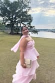 I loved this dress! It fit so perfectly, and I received so many compliments!  Didn't budge much the wheel at night, either considering it is strapless. I had gotten the scarf elsewhere for an extra accessory! - Bryana R.