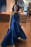 I've been a longtime Lulus shopper, and I'm not exaggerating when I say this might be one of my all-time favorite dresses from them! I ordered a size medium, and it fits true to size. Every detail is perfection, from the way the straps flatter my shoulders to the stunning asymmetrical flare and layered skirt. The train in the back is absolutely to die for and flows beautifully when you walk.
The fabric has a slightly heavier feel, which I actually love; it gives the dress a more luxurious, durable quality that feels like it will last. It's also very easy to slip on and zip up, and the material itself is gorgeous. I did take a few minutes to steam it before my event to smooth out some light wrinkles from packaging, and it made it look even more polished.
I got mine in navy blue, but I might be getting the emerald green one here pretty soon. - Ireland J.