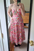 This dress is very pretty. The boning on the bodice and corset back makes it fit your torso beautifully. Unfortunately, it never stood a chance of containing my boobs (32DD). I thought the small fit my body really well, but too small for my boobs. The medium fit my boobs better (still not big enough), but the bodice was not tight enough, even when tightly laced. Maybe I could have made it work with straps, but I didn't feel confident it would stay up, nor was it as tight as I wanted. I am returning it because I don't feel confident it will stay up in either size. The zipper felt very fragile, and I was worried it would break even while trying it on, much less while wearing it for an event. The full body photo is the medium, and the photo with a blue background is the small. This is a lovely dress that would probably work for people whose chest and waist sizes are more proportional. - Rebecca W.