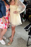This dress was so cute! Wore it for a graduation/derby party! It is very short, but super soft and stretchy. The material on the sleeves is not itchy whatsoever. - Heather S.