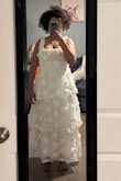 I bought this dress for my wedding. I'm 5'2, and the length of the dress is perfect even with heels on. The only downside is the straps are a little big on me, but otherwise absolutely beautiful dress. The flowers on the dress are the perfect size, too. - Maia L.