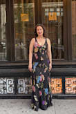 It fits well but is also flowy. I wore this to a benefit gala. Nice for pear-shaped with hip dips. Dress is long. It was floor length on my 5'9 frame with 1" heels. - Dania R.
