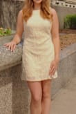 I bought this dress for my college graduation, and I love it! The crochet detailing is well done and doesn't come apart, and the dress looks very professional. It is not stretchy but it is still form fitting. - Eydie M.