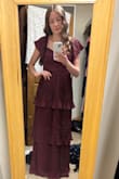 Gorgeous dress, very flattering, and beautiful color! I do wish there were cups on it, but the tie-back makes it possible to tighten the bust area and wear without a bra if desired. Pleats on the skirt are very elegant and the quality is great. It is pretty long and I will likely need it hemmed. Overall, a great dress! - Maren B.