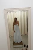 Got this dress for my bridal shower. Ordered a size small and had to get it altered, got it taken in 5 inches, and had to get it hemmed even with my tallest heels. I altered it because I really love the style of dress on me, and it was so worth it. But definitely size down and get fashion tape! - Rachel K.
