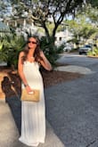 wore this dress for my bachelorette and absolutely loved it! It definitely runs large - I had initially ordered a S, and it was literally falling off. The XS fit much better around my chest but was still extremely long (I'm 5'8 and wore it with heels, but I was still tripping on the material at the bottom). Overall, LOVED this dress and would wear again - will prob just get it hemmed! def gives very coastal vibes! - Emma K.