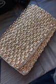 The clutch is a much brighter yellow gold in person than it appears in the photos, and the beads feel more plastic-like than I expected. The closure is also sewn a bit crooked and the bag doesn't sit upright on a flat surface the way it does in the product images. Overall, it doesn't have the luxurious feel I was hoping for, but it's still a fun, affordable bag for a night out. - Cassandra T.
