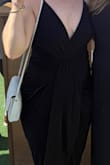 I loved this dress! I carry a bit of extra weight in my tummy and this dress covered the areas I'm a bit self-conscious about. I wore biker shorts and did feel like the dress rode up a bit as I danced, so I was glad I had them on. I used tape to secure the bodice. Definitely recommend! - Emily D.