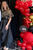 I recently wore this to a Hollywood Glam theme gala. It's basic in black, but the fabric and fit elevate the look. It fit like a glove - fitted on the chest and at the natural waist, flowy in the lower tummy/hips. It made me feel elegant and classy. - Erin A.