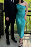 This dress looked great and felt good on.  I got a lot of compliments at the wedding I attended.  I did size up since it runs small. - Lu A.
