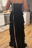 I love the dress and the fit, but the zipper is not great. I feel like it's going to break at any moment, even though the dress fits perfectly. It gets stuck so many times that it takes like two people to zip it up. But the dress itself is so beautiful, and I love it. Also, I sized down by one size after seeing the reviews. Definitely the right choice. I'm usually a small, and I got an XS for this dress, and it still turns a little big - Gloia G.