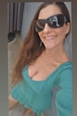 The material is so pretty. Lots of compliments received wearing both colors of the dress. Paired it with knee high boots. But it can be worn with sandals or heels depending on the vibe you are trying for. - Cece C.