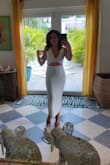 I absolutely love this dress! Girls trip in the Bahamas. We had a chef come to the airbnb, all wore white and went out after. I got lots of looks and compliments. I felt so sexy and beautiful yet classy. The material is ribbed and of really great quality. I love the center opening and the side slit. - Tara J.