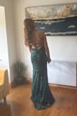 This dress was perfect for my ball. I ordered it and it arrived slightly before it was estimated. It fit very well, just a small bit big where the zip is at the back, I'm sure that was just me. The colour is gorgeous and the sequins didn't fall off at all. Got compliments on it all night, I would definitely recommend. - Laura F.