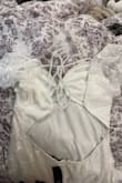 I was so excited to wear this dress but it came in damaged. The pictures of the dress and pics from the reviews show that it has strings for the top and the bottom, and yet mine came in with only strings on the top. This is extremely disappointing considering I was supposed to wear this for an upcoming event. It's why I even paid for overnight shipping. - Natasha S.