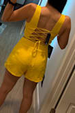 The color is more of a bright mustard yellow not so much like the color as shown but still love it. The skirt is longer than expected, but it's great. I love the fit. I'm gonna get it in all colors, it's so flattering. The top is adjustable. The bottom is slightly big but comfortable to where when I sit down it won't squish my belly out. Hehe - Jen H.