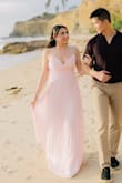 This dress was absolutely breathtaking for my engagement photo shoot on the beach! The pink shade is so flattering, and the flowing nature of the dress is magical. The fit is really flattering as well - Lourd K.