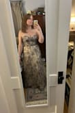I am between a medium and a large. I ordered a size up to XL, and it fit more like a medium. Beautiful and pretty flattering. I almost returned it because I don't know when I will wear it, but I loved it so much I decided to keep it. I will say that the boob area is pretty loose and gaping. You can't tell in the photos, but I'll have to wear fabric tape to keep everything secure. - Kathleen O.