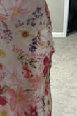 When I originally received this dress, I was so happy with it. Looks beautiful in person and fit me well and I was going to wear it to a wedding. However, I then washed the garment, and the dress is no longer wearable. I washed it according to the directions (hand wash cold & line dry), but the outer layer still shrank. I had no problem with it being slightly shorter and would have been fine with hemming the lining, but the true issues is that the shrinking caused ripples on the hip seams. The dress was cut on the bias and was likely stretched too much during sewing. This means there is no way to fix this issue. I am extremely disappointed in the construction of this dress and don't recommend buying it. Also, because it was washed and tags were removed, I can't return it. - Victoria A.