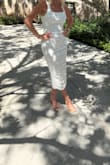 I wore this to my graduation, and it was perfect! The material is beautiful and even more beautiful in person. My husband loved it on me. It's form fitting but doesn't look clingy or too tight. I was worried about it being too sexy for graduation, but it looks so classy and chic! - Amanda A.